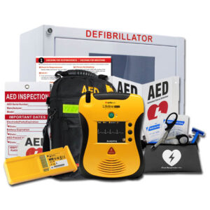 Defibtech Lifeline PRO AED Value Package with yellow defibrillator, wall cabinet, backpack, battery, CPR kit, AED signage, and inspection tag for advanced emergency response.